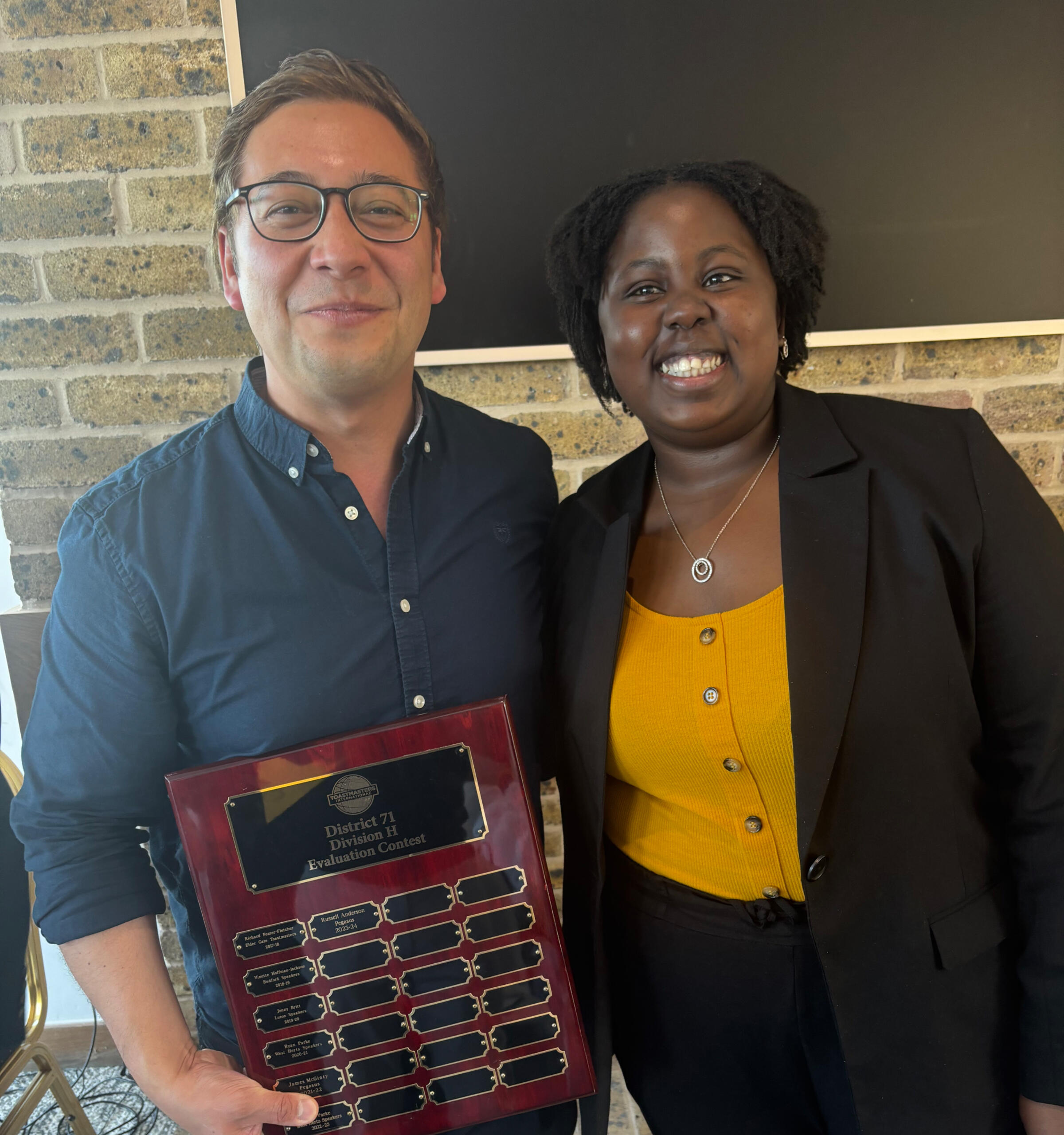 Toastmasters International Speech and Evaluation Contest Division H Winners; Geoff Huntington and Colletor Gumbo.